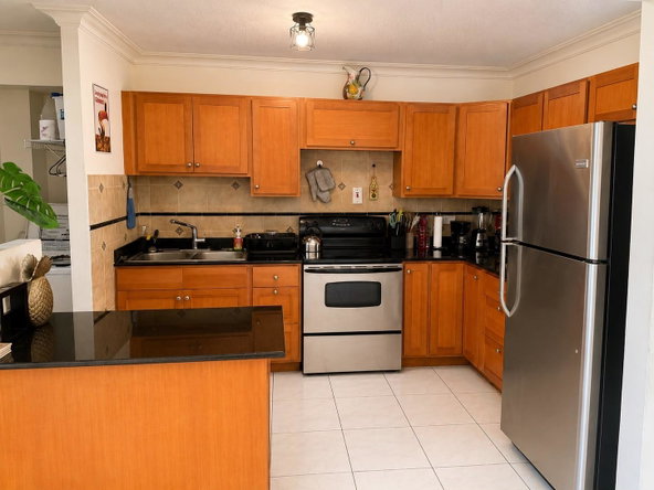 Fifth image of 13 White Cedar Road in Mango Walk C-Club, St. James, Jamaica - property is For Rent