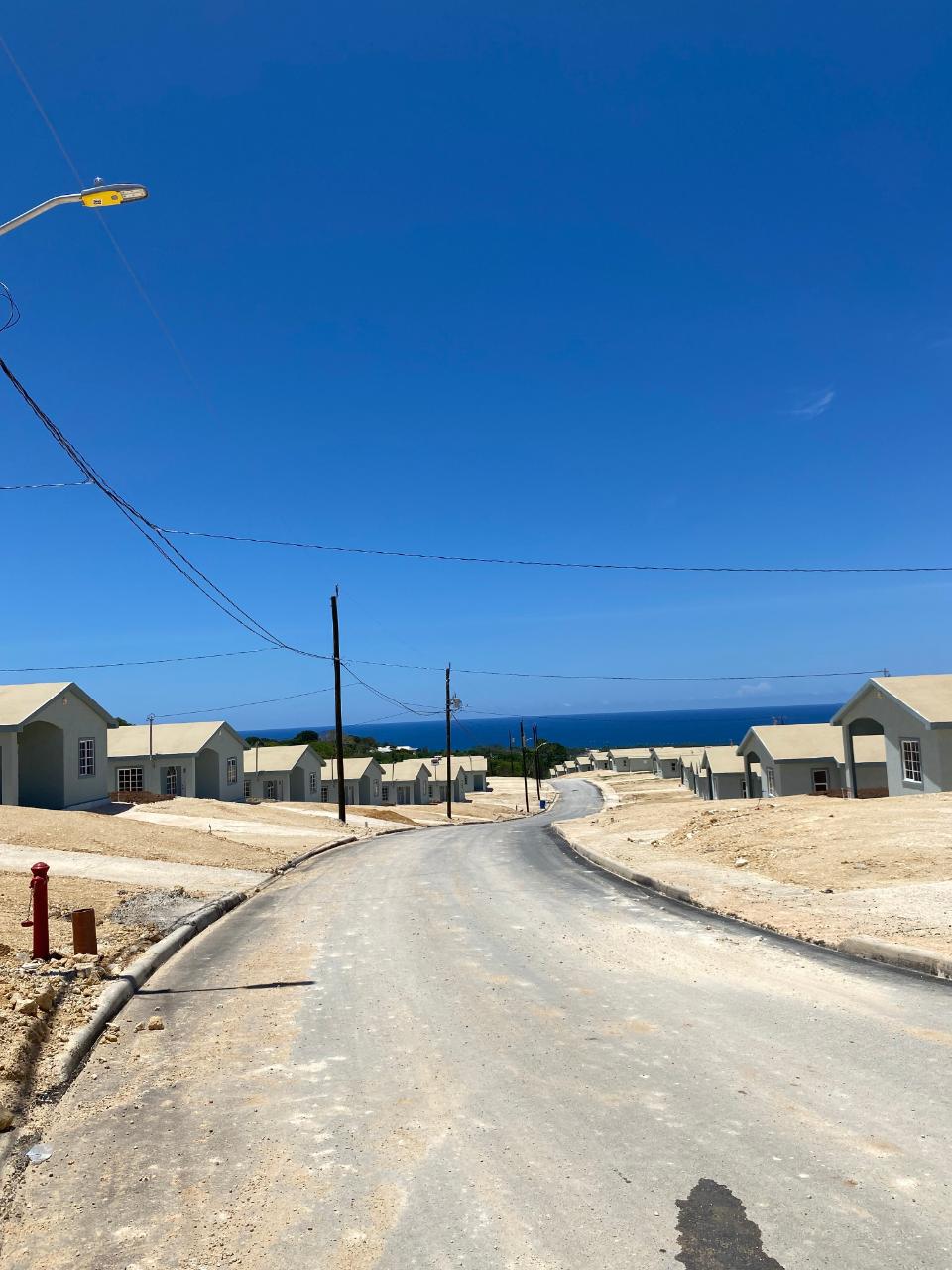 Charming-2-Bedroom-House-for-Rent-in-Gated-Community-near-Puerto-Seco-Beach-Jamaica First image of Lot 181d Phase 4 Camelot Village in Discovery Bay, St. Ann, Jamaica - property is For Rent