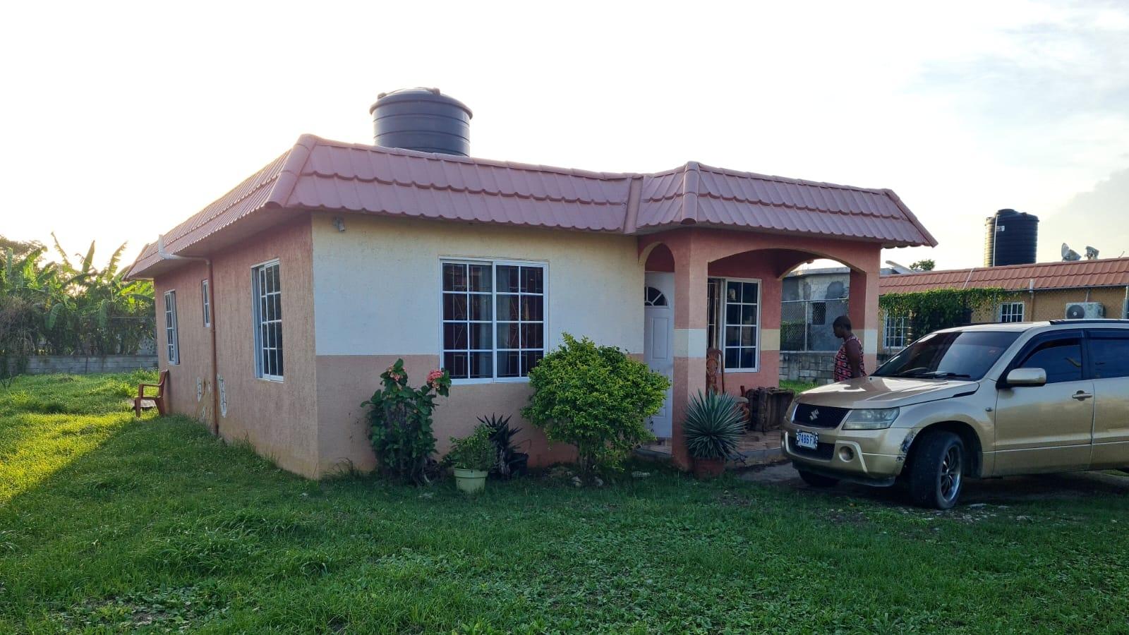Charming-2-Bedroom-House-for-Sale-in-Casa-Buena-Estates-Westmoreland-Jamaica Third image of Lot 23 Casa Buena Estates in Farm Pen, Westmoreland, Jamaica - property is For Sale