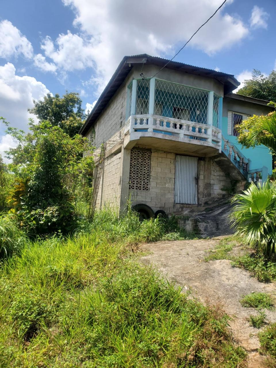 Charming-2-Bedroom-House-for-Sale-in-Heartease-Jamaica First image of 25 Joseph Ashley Drive, Hear in Heartease, Manchester, Jamaica - property is For Sale
