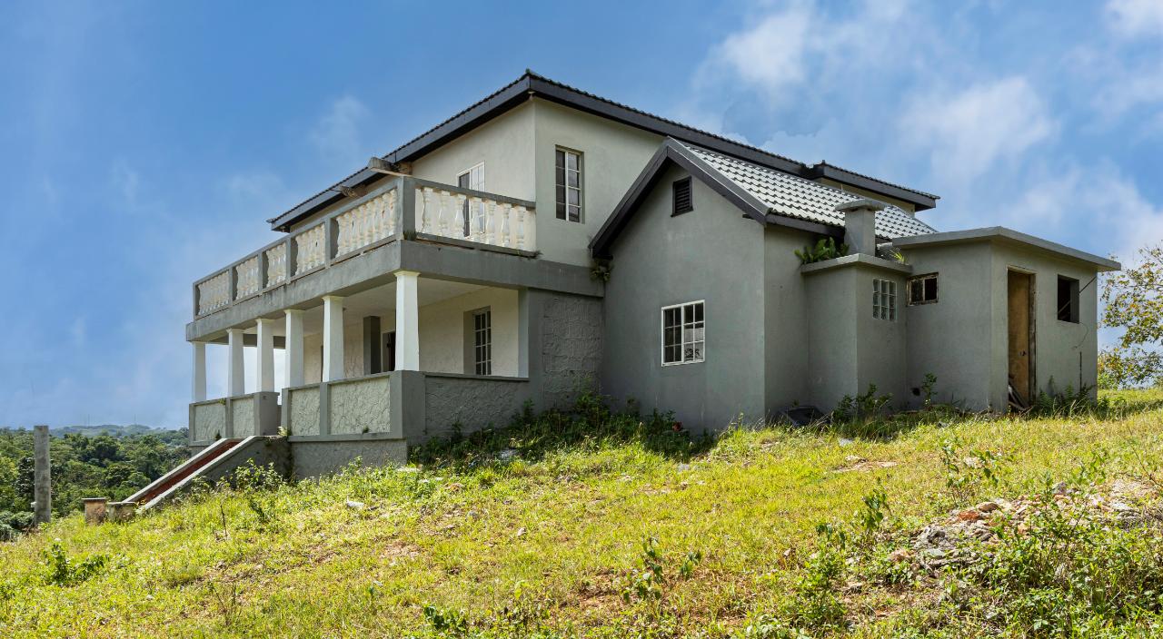 Charming-3-Bedroom-House-for-Sale-in-Knockpatrick-Jamaica First image of Lot 7 Knockpatrick, Manchester in Knockpatrick, Manchester, Jamaica - property is For Sale