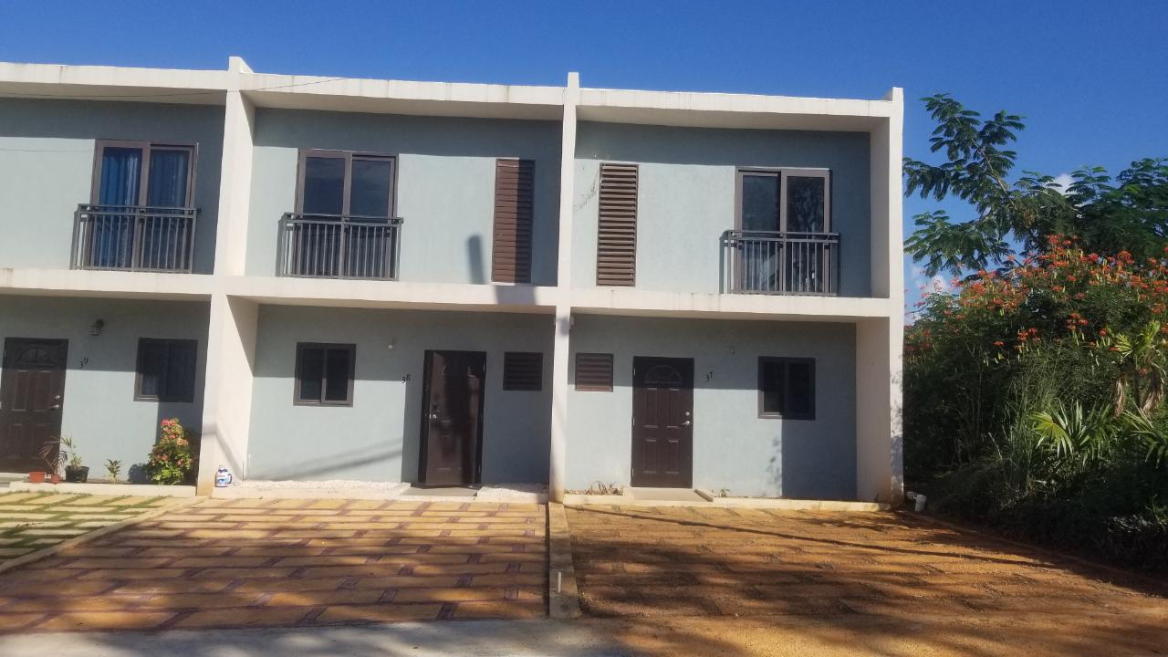 Charming-Townhouse-for-Sale-in-Camelot-Village-Jamaica First image of 38 Camelot Village in Discovery Bay, St. Ann, Jamaica - property is For Sale
