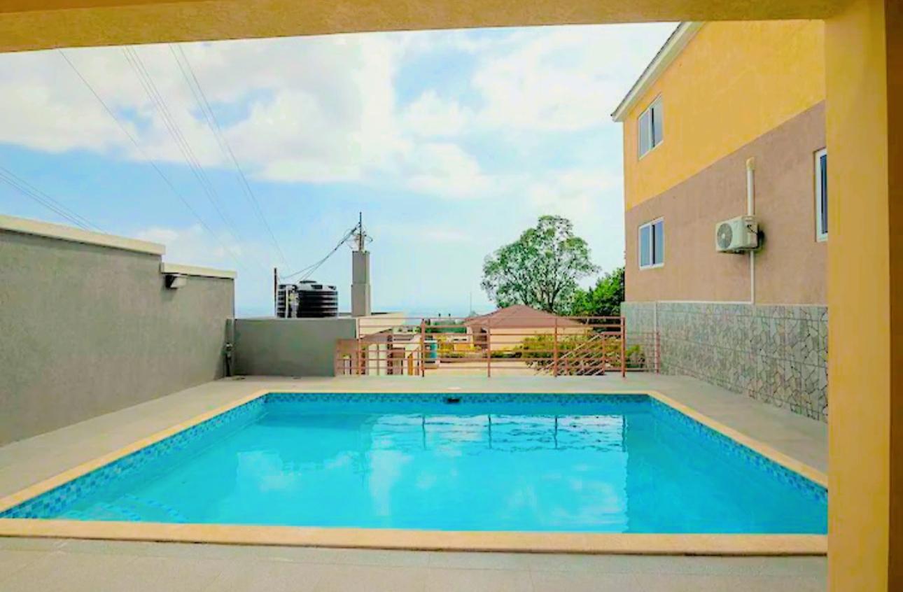 Furnished-2BR-Apartment-for-Rent-in-Kingston-with-City-Views Second image of 7-13a Leas Flat Close, Kingston in Kingston 19, St. Andrew, Jamaica - property is For Rent