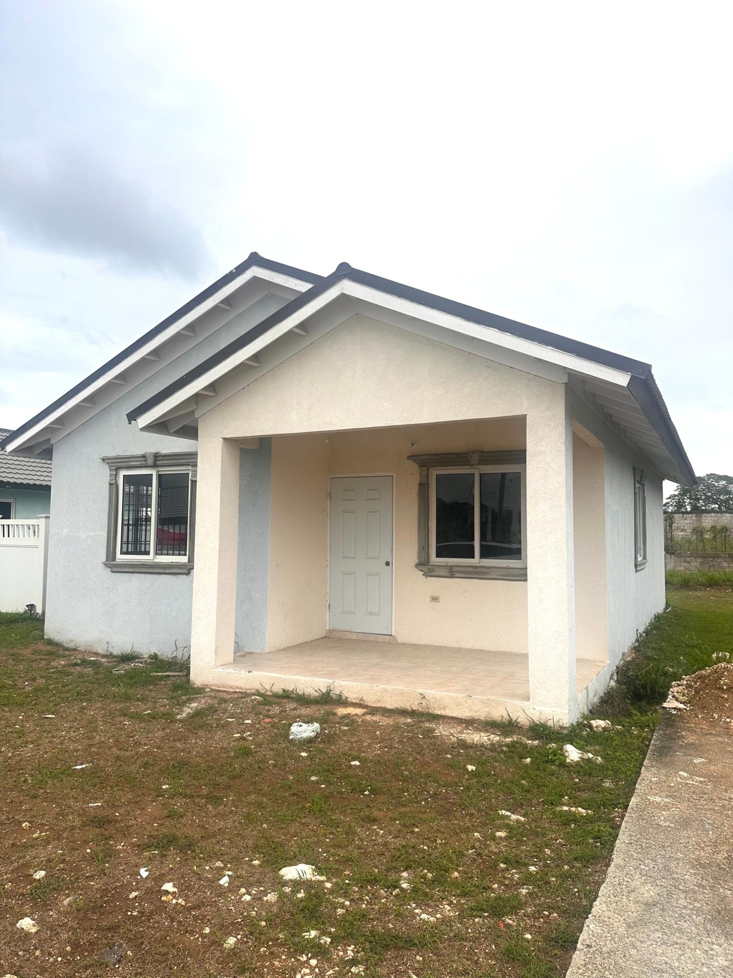 Modern-2-Bedroom-House-for-Sale-in-The-Orchards-St.-Catherine First image of Lot 696 Java Plum Crescent, Phase in Innswood, St. Catherine, Jamaica - property is For Sale