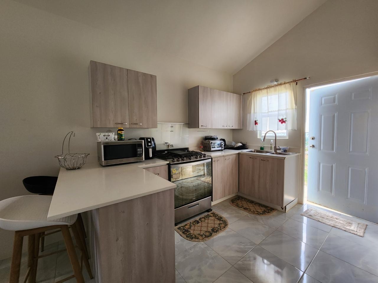 Stunning-2-Bed-Home-with-Sea-Views-in-Discovery-Bay-Jamaica Seventh image of 343 Camelot Blvd in Discovery Bay, St. Ann, Jamaica - property is For Rent