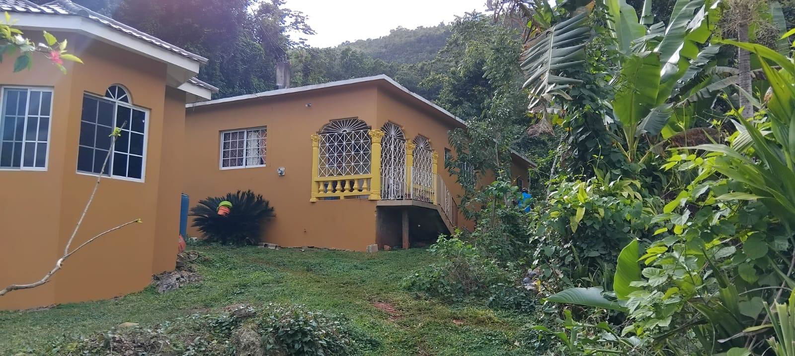 Income-Generating-Homes-for-Sale-in-Moneague-Jamaica First image of Lot 1-roadside Retirement Road, Roadside in Moneague, St. Ann, Jamaica - property is For Sale