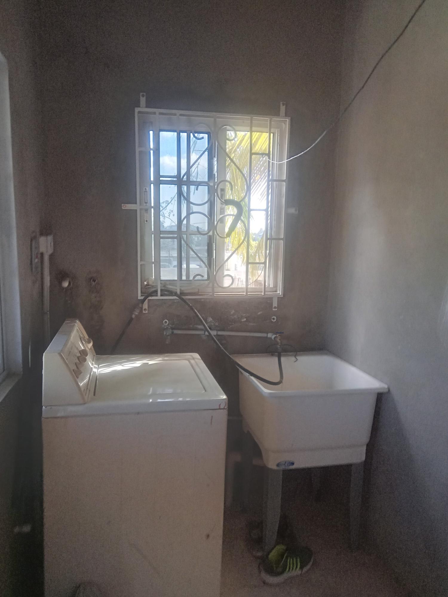 Spacious-Two-Story-Home-in-Sydenham-Villa-Jamaica-Ideal-for-Multi-Family-Living Fifteenth image of 399 Syndenham Villa in Spanish Town, St. Catherine, Jamaica - property is For Sale