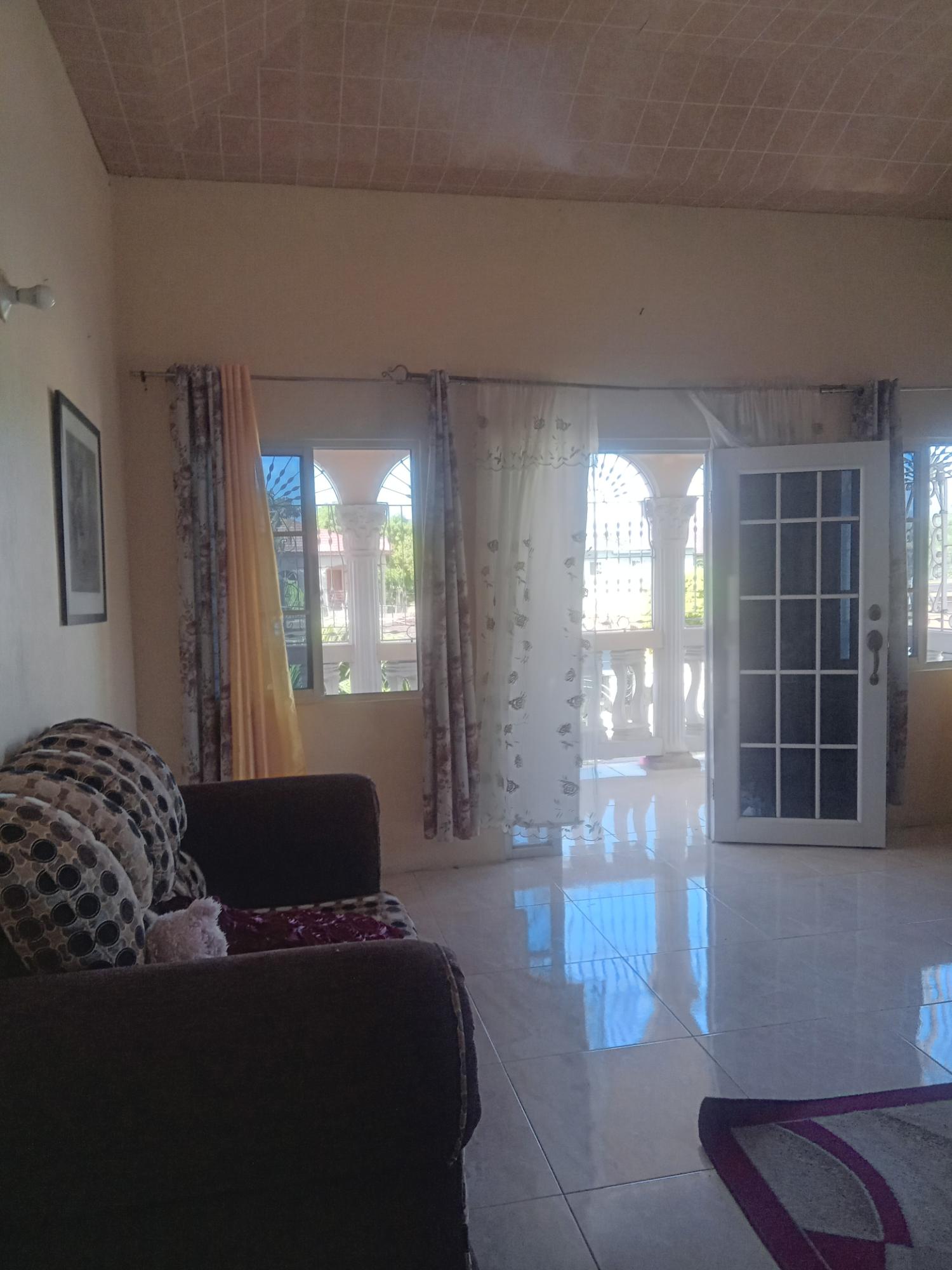 Spacious-Two-Story-Home-in-Sydenham-Villa-Jamaica-Ideal-for-Multi-Family-Living Third image of 399 Syndenham Villa in Spanish Town, St. Catherine, Jamaica - property is For Sale