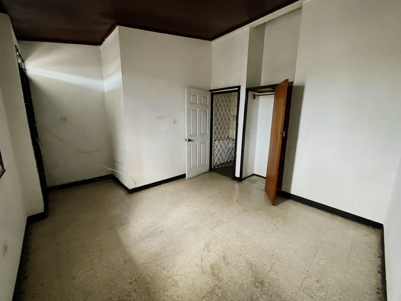 Fixer-Upper-Townhouse-for-Sale-in-St.-Andrew-Jamaica-–-Great-Investment-Opportunity Twenty-Second image of 8- Ritchie Mews in Kingston 8, St. Andrew, Jamaica - property is For Sale