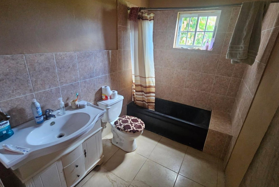 Twelfth image of 216 Sandhill Circle in HELLSHIRE HILLS, St. Catherine, Jamaica - property is For Sale