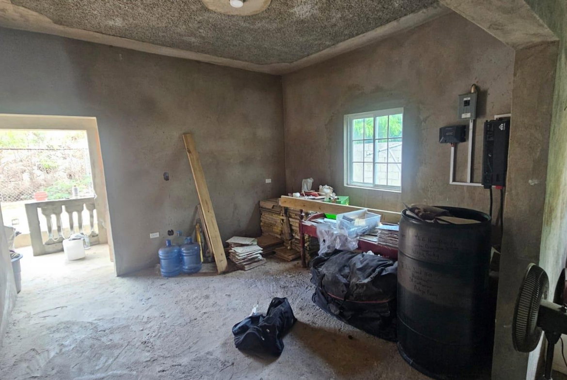 Seventh image of 216 Sandhill Circle in HELLSHIRE HILLS, St. Catherine, Jamaica - property is For Sale
