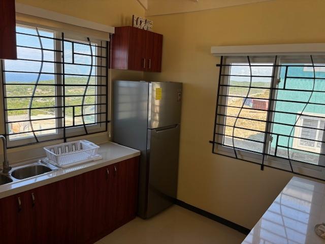 Thirteenth image of 123 Edmund Ridge Estaes in SPOT VALLEY, St. James, Jamaica - property is For Rent