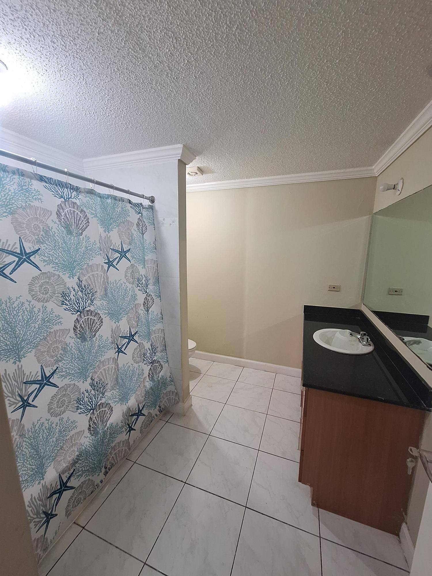 Fifteenth image of 54 Poui Circle, Mango Walk c in Mango Walk C-Club, St. James, Jamaica - property is For Rent