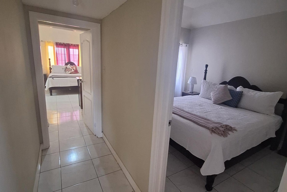 Eighteenth image of 54 Poui Circle, Mango Walk c in Mango Walk C-Club, St. James, Jamaica - property is For Rent