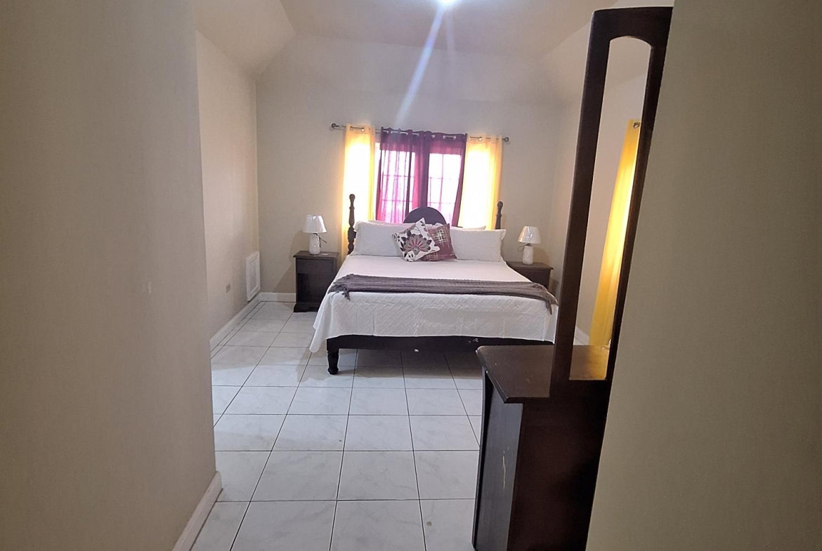 Nineteenth image of 54 Poui Circle, Mango Walk c in Mango Walk C-Club, St. James, Jamaica - property is For Rent